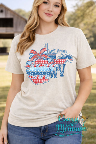 Woman in an Americana WV Tee, featuring a West Virginia map with red, white, and blue patterns.