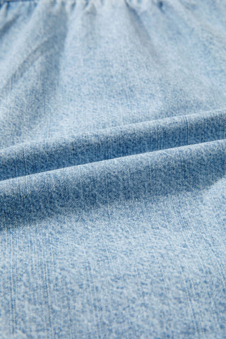 Close-up of light wash Canyon Frayed Hem Shorts, showing the texture of the distressed denim fabric.