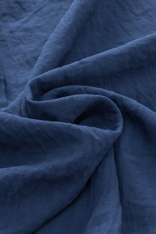Close-up of the Canyon Horizon Blouse, showcasing its deep blue, crinkled fabric with subtle texture.