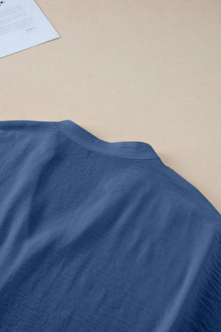 Close-up of the blue Canyon Horizon Blouse, showing the crinkle texture and collar detail.