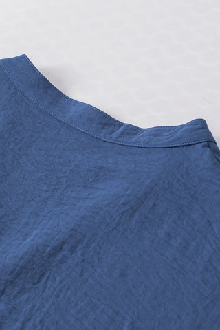 Close-up of the Canyon Horizon Blouse, showing the blue boho crinkle V-neck fabric and collar detail.