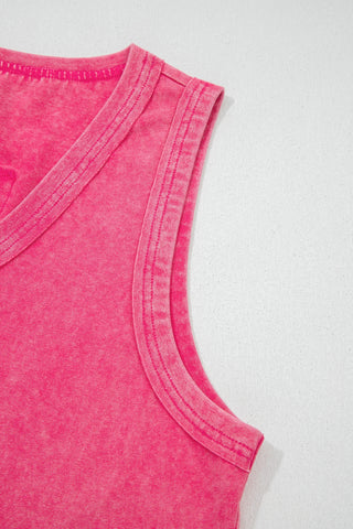 Close-up of a vintage fuchsia tank top with a v-neck and ribbed trim on the neckline and armholes.