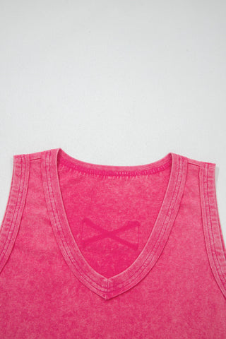 Close-up of a Canyon Rose Tank, a vintage fuchsia tank top with a V-neck and distressed texture.
