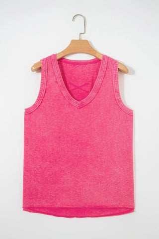Canyon Rose Tank, a vintage fuchsia tank top with a v-neck, hanging on a wooden hanger.