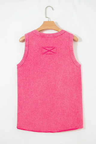 Back view of a Canyon Rose Tank, a vintage fuchsia tank top with a subtle washed texture, hanging on a hanger.