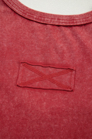 Close-up of the Canyon Sunset Tank, showing the red fabric with a distressed look and a decorative stitched patch.