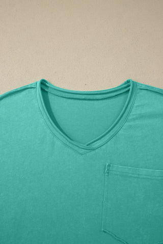 Close-up of a Canyon Teal Pocket Top, showing the washed teal V-neck and a single chest pocket.