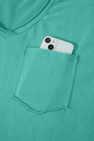 Close-up of a Canyon Teal Pocket Top with a phone in the pocket, highlighting the washed teal V-neck tee.