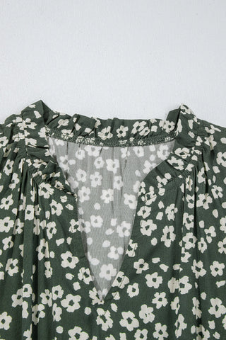 Close-up of the Cloverfield Mini Dress, an olive floral mini dress with a ruffled neckline and V-neck.