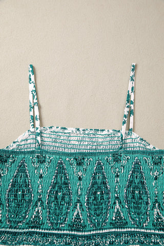 Close-up of the Country Breeze Maxi Dress, showing the shirred bodice and teal bohemian floral pattern.
