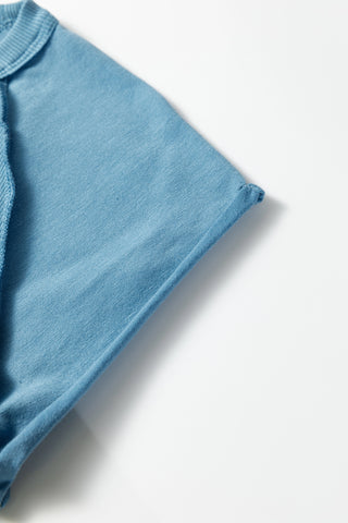 Close-up of the light blue Creekside Ribbed Top, showing the ribbed crew neck and sleeve detail.