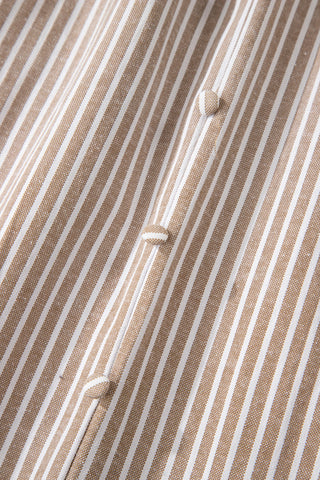 Close-up of the Daisy Lane Maxi Dress fabric, showing brown and white stripes with covered buttons.