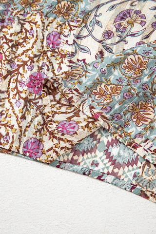 Close-up of the Desert Bloom Kimono showing a patchwork of bohemian floral and geometric patterns.