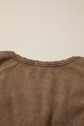 Close-up of the Desert Mesa Ribbed Tank, showing the brown ribbed fabric and the distressed neckline.