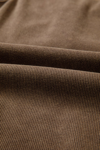 Close-up of the Desert Mesa Ribbed Tank, showing the brown ribbed fabric with soft folds.