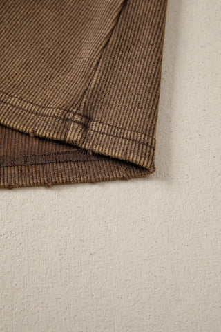 Close-up of the Desert Mesa Ribbed Tank, showing the brown ribbed fabric and hem detail.