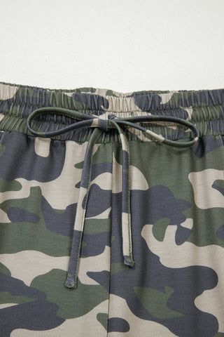 Close-up of Desert Trail Camo Shorts with an elastic waistband and tied drawstring in a desert camo pattern.