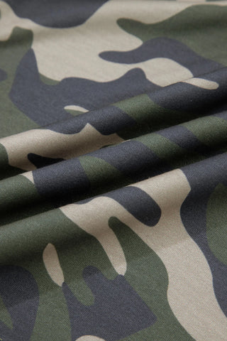 Close-up of Desert Trail Camo Shorts fabric, showing green, tan, and dark grey camouflage pattern.