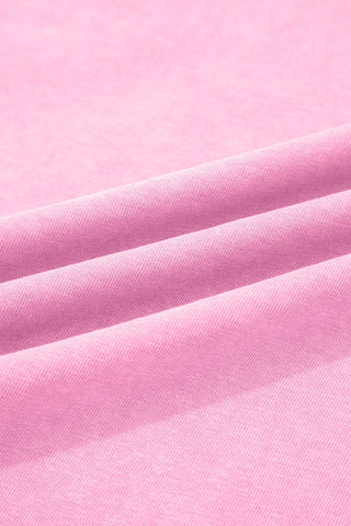 Close-up of the dusty rose fabric of the pocket top, showing its soft texture and subtle folds.