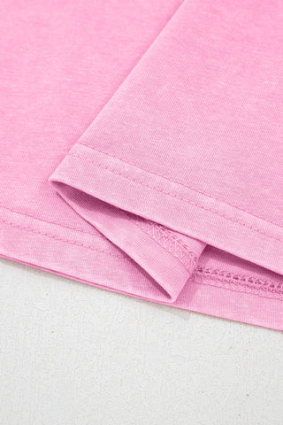 Close-up of the dusty rose pocket top fabric, showing the soft texture and detailed stitching.