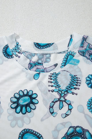 Close-up of a white Frontier Concho Tee with a turquoise concho pattern around the neckline.
