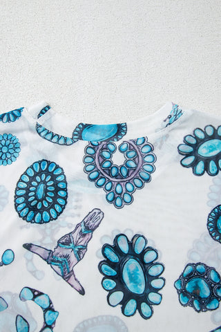 Close-up of a white Frontier Concho Tee with various turquoise concho designs and a longhorn skull.