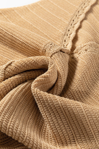 Close-up of a golden hour sleeveless top, showing the intricate crochet knit texture and delicate trim.