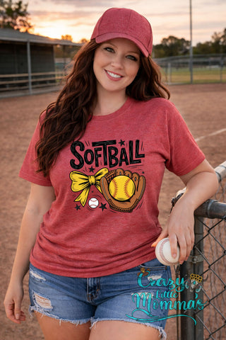 Woman in a red softball tee with "Softball" text, a yellow bow, a glove, and a softball graphic.