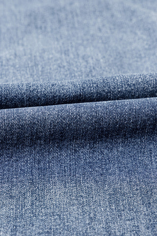 Close-up of the light blue denim fabric of the Highway Honey Flare Jeans, showing texture and folds.