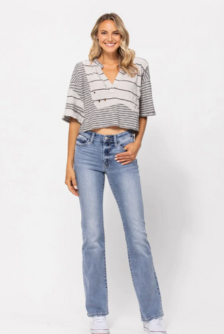 Model wearing Judy Blue Mid Rise Light Wash Bootcut Country Jeans