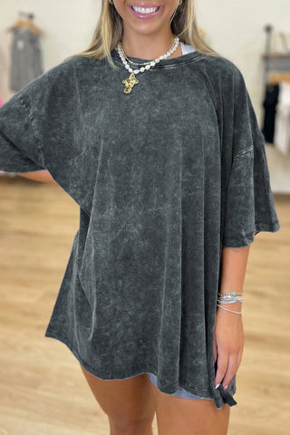 Model wearing an Outlaw Washed Oversized Top, a dark gray washed distressed tee with a relaxed fit.