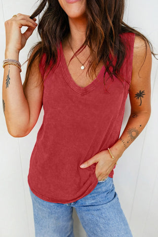 Woman wearing a red Canyon Sunset Tank with a V-neck, paired with light wash jeans.