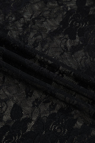 Close-up of the Midnight Bloom Lace Top, showcasing the delicate black floral lace fabric with subtle sheerness.