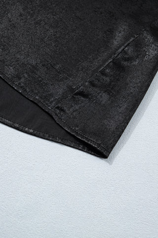 Close-up of the Midnight Shimmer Top, showing the black fabric with a subtle shimmer and draped texture.