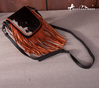 Montana West Cowhide Fringe Crossbody Purse in orange with black and white cowhide flap and long orange fringe.