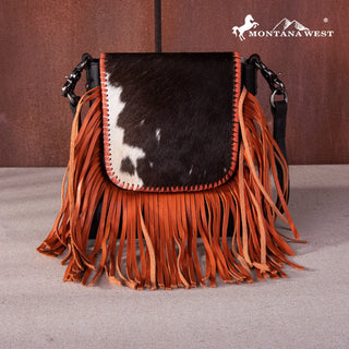 Montana West Cowhide Fringe Crossbody Purse in orange with a black and white cowhide flap.