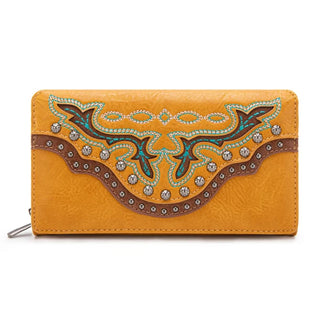 Mustard yellow wallet with brown, turquoise, and gold embroidery, silver studs, and a brown studded trim.