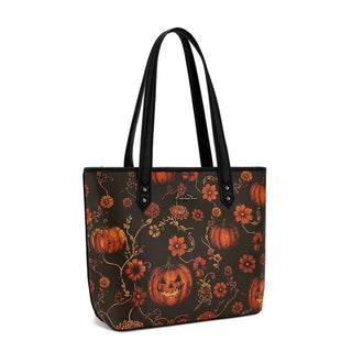 Montana West Pumpkin Floral Halloween Tote with black handles, featuring pumpkins and orange flowers on a dark background.