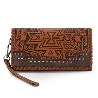 Brown Montana West wallet with Aztec tooling, floral accents, silver studs, and a wrist strap.