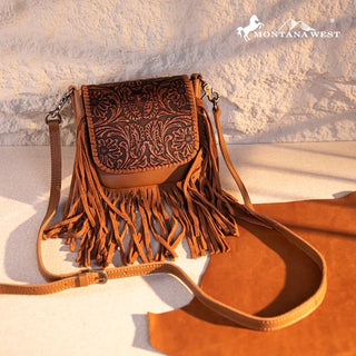 Brown Montana West crossbody purse with a tooled leather flap and long fringe.