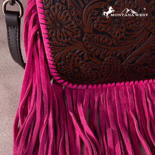 Close-up of a Montana West Tooled Leather Fringe Crossbody Purse in hot pink, showing floral tooling and fringe.