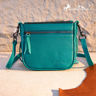 Turquoise Montana West Tooled Leather Fringe Crossbody Purse with a front zipper pocket and shoulder strap.