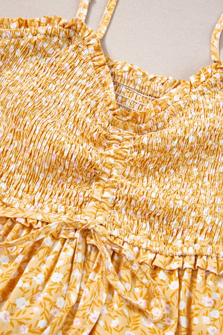 Close-up of the Open Fields Maxi Dress, a yellow floral maxi dress with smocked bodice and tie waist.