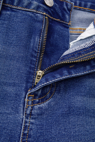 Close-up of the zipper and button fly of Open Sky Bootcut Jeans, showing the blue denim fabric.