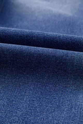 Close-up of the dark blue denim fabric of the Open Sky Bootcut Jeans, showing texture and subtle fading.