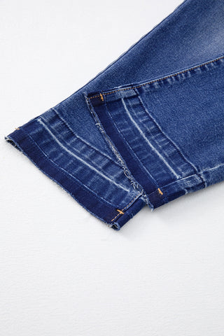 Close-up of the distressed hem of Open Sky Bootcut Jeans, showing frayed edges and visible stitching.