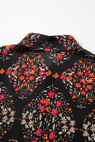 Close-up of the Porchlight Bloom Button Top, a black floral lattice blouse with red and orange flowers.