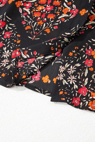 Close-up of the Porchlight Bloom Button Top, a black floral lattice blouse with red and orange flowers.