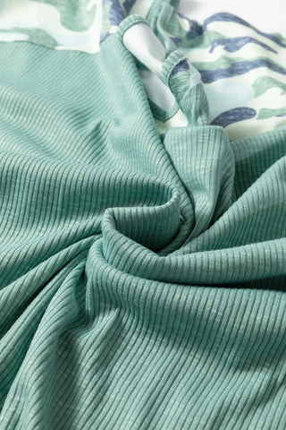 Close-up of the Prairie Camo Dreams Top, showing the ribbed sage green fabric and a hint of camo print.