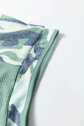 Close-up of a Prairie Camo Dreams Top, showing the sage green ribbed fabric and blue-green camo print.